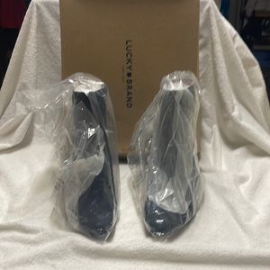 Short zip ankle boot with  inch thick heel. Smoke free home. No tears. NIB